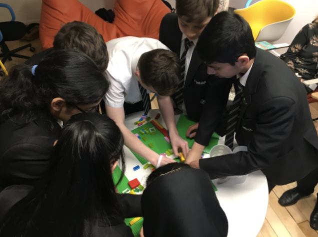 Pupils working collaboratively on a lego project